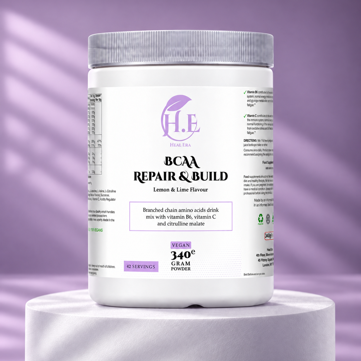A white tub of H.E Nutrition BCAA Repair & Build powder with a purple logo and label accents, displayed on a white pedestal against a purple background.