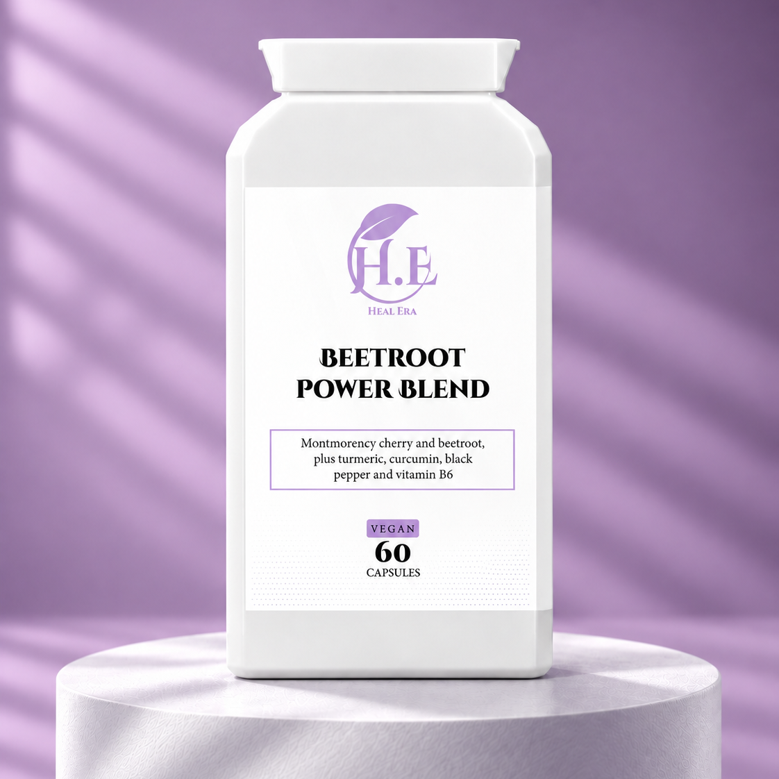 A white bottle of H.E Vegan Tea Beetroot Power Blend capsules, displayed on a matching white cylindrical pedestal against a purple background with soft diagonal shadows.