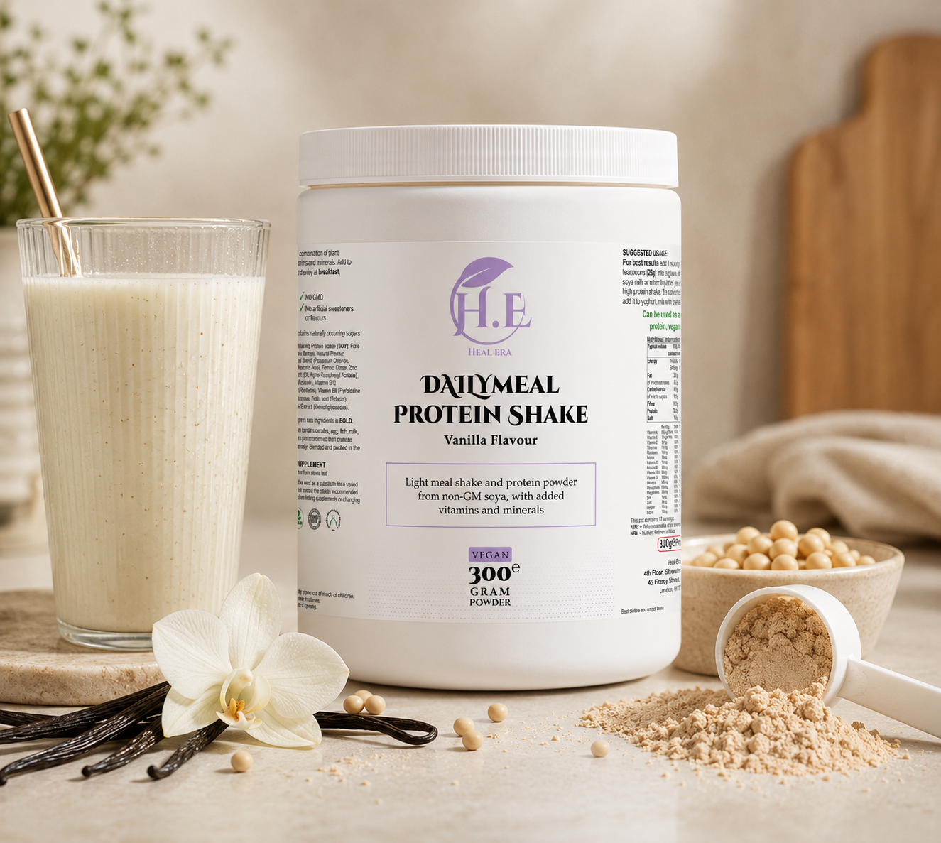 A white tub of H.E Daily Meal Protein Shake in Vanilla Flavour, styled on a light wooden surface with a glass of vanilla milk, vanilla beans, a white orchid flower, and a scoop of powder.