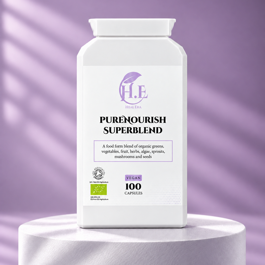 A white bottle of H.E Herbs Ltd PureNourish Superblend vegan capsules, displayed on a white cylindrical pedestal against a lavender-purple background with soft diagonal shadows.