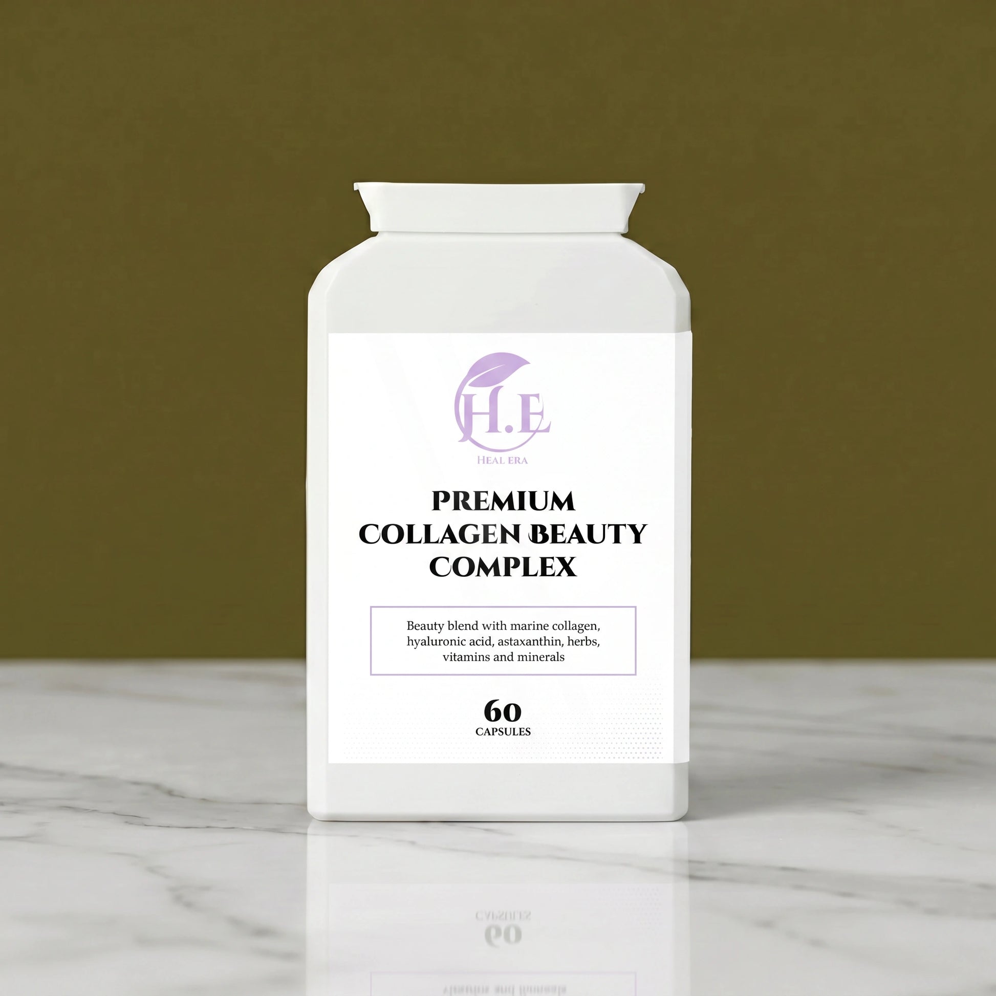 A white bottle of H.E Premium Collagen Beauty Complex capsules, set on a white marble surface against a solid olive green background.