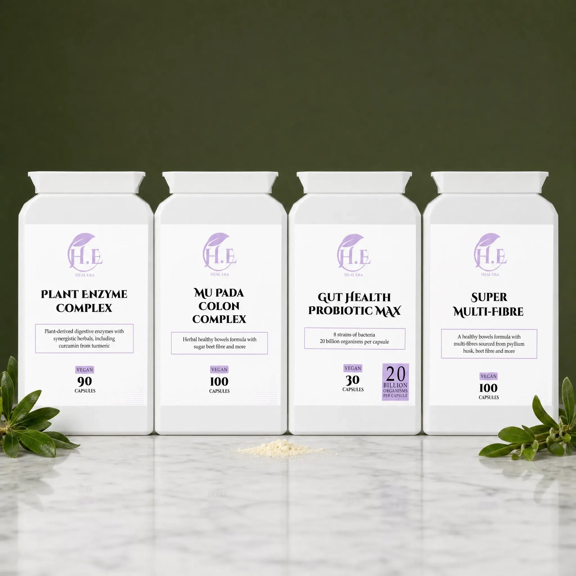 Four white supplement bottles arranged in a row on a marble surface against a dark olive background. The bottles are labeled H.E